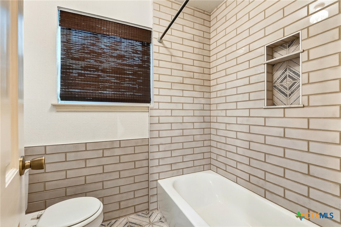 3102 Las Cruces Boulevard Temple, TX 76502 - Photo 25 of 37 a bathroom with a toilet and sink