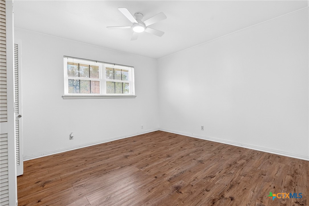 3102 Las Cruces Boulevard Temple, TX 76502 - Photo 28 of 37 an empty room with wooden floor and windows