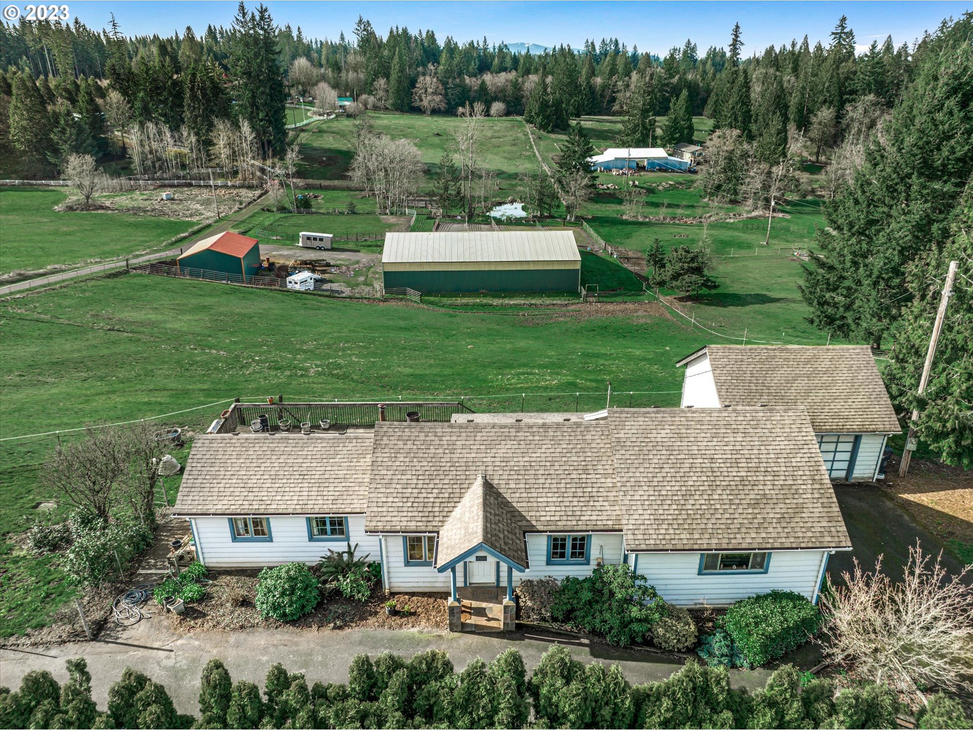 an aerial view of a house with garden space and street view