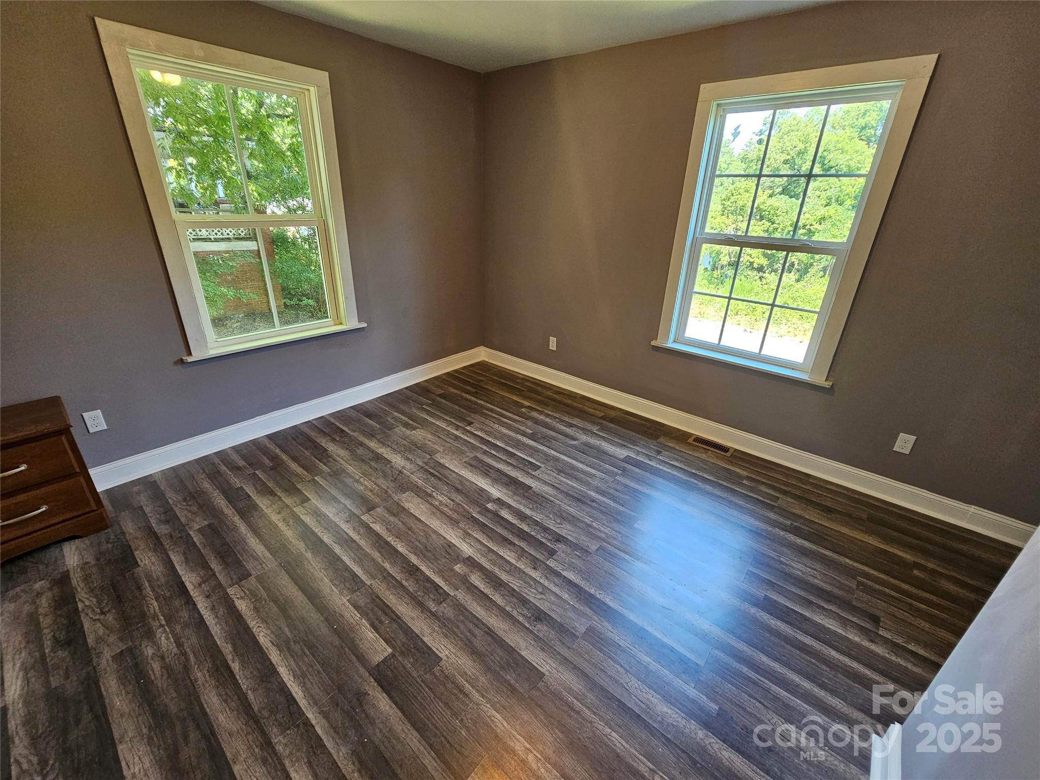 31 Poplar Street Great Falls, SC 29055 - Photo 14 of 16 a view of a room with wooden floor and windows