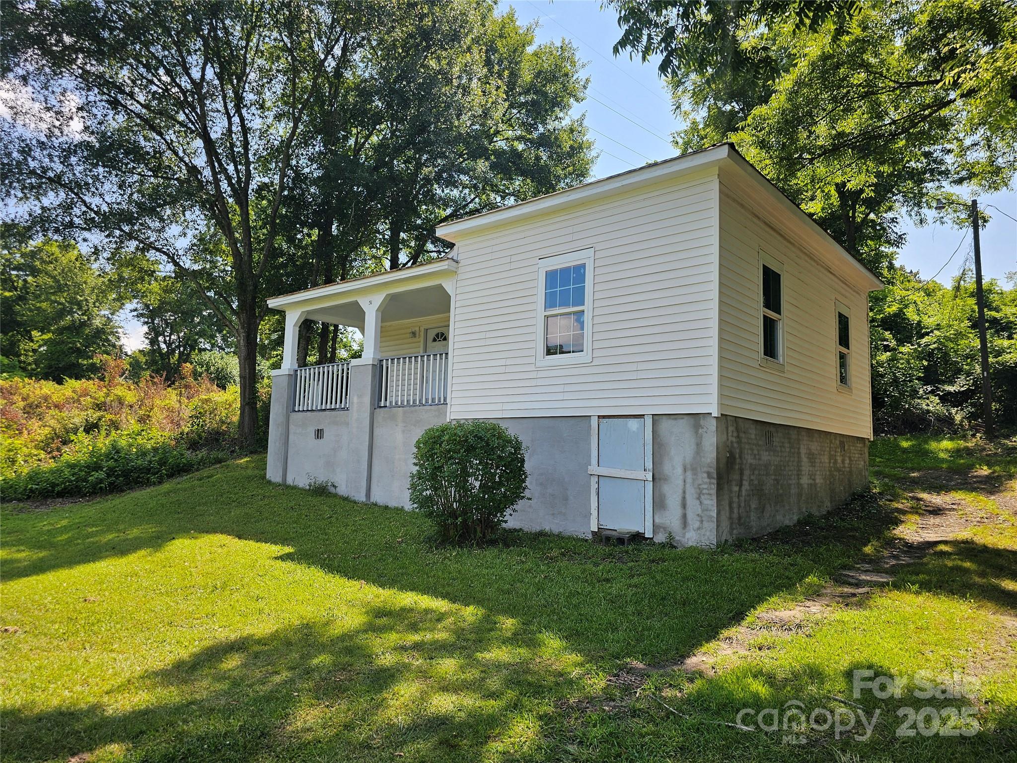 31 Poplar Street Great Falls, SC 29055 - Photo 2 of 16 a view of backyard with garden and plants