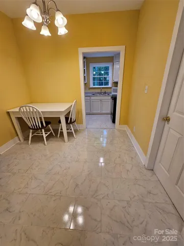 a view of a livingroom with furniture and window