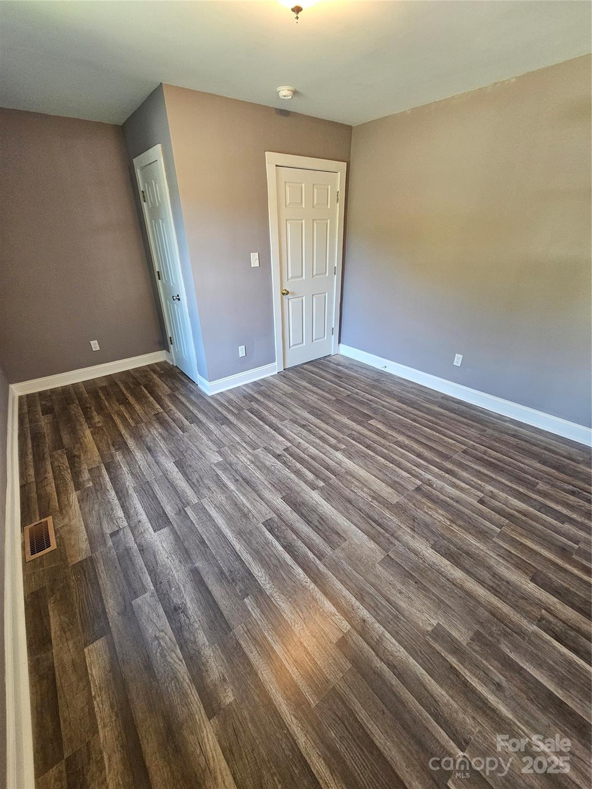 31 Poplar Street Great Falls, SC 29055 - Photo 10 of 16 a view of empty room with wooden floor