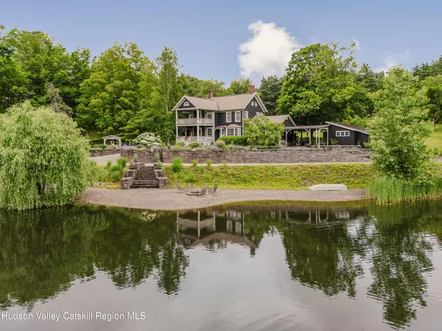 a view of a lake with a house in the background