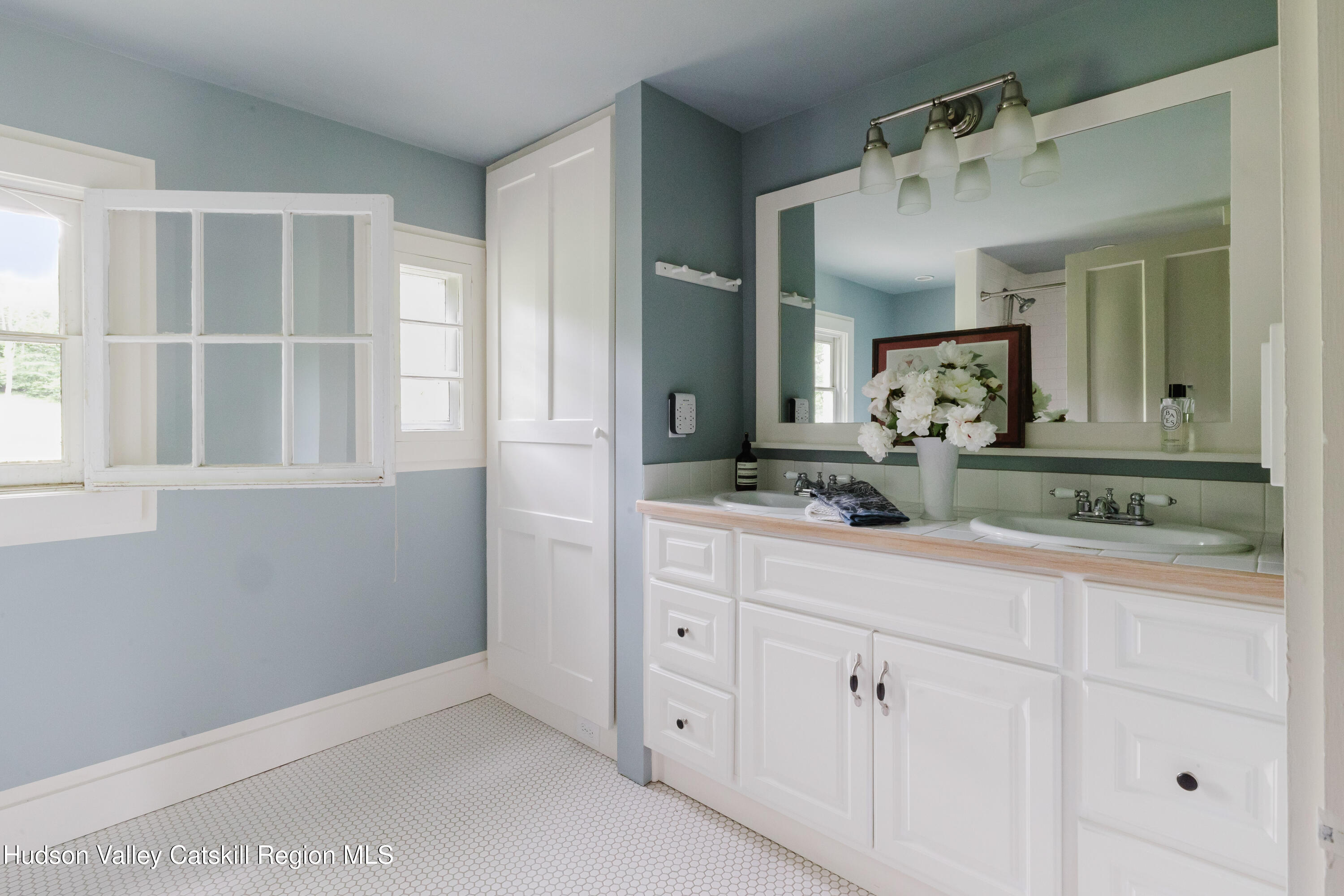 88 Mac Brown Road Hillsdale, NY 12529 - Photo 41 of 69 a bathroom with a granite countertop sink mirror and vanity
