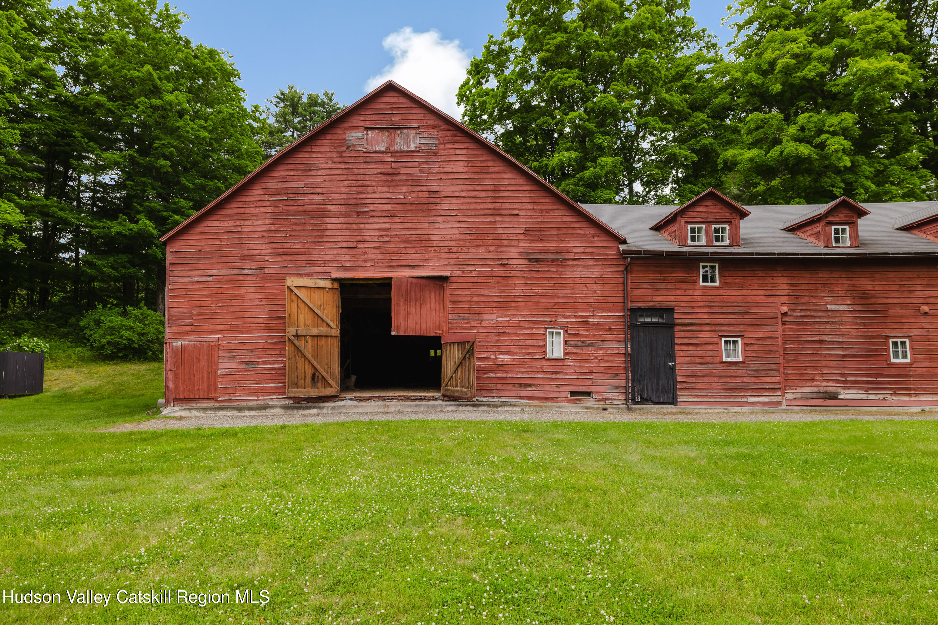 88 Mac Brown Road Hillsdale, NY 12529 - Photo 52 of 69 a view of a brick house with a yard
