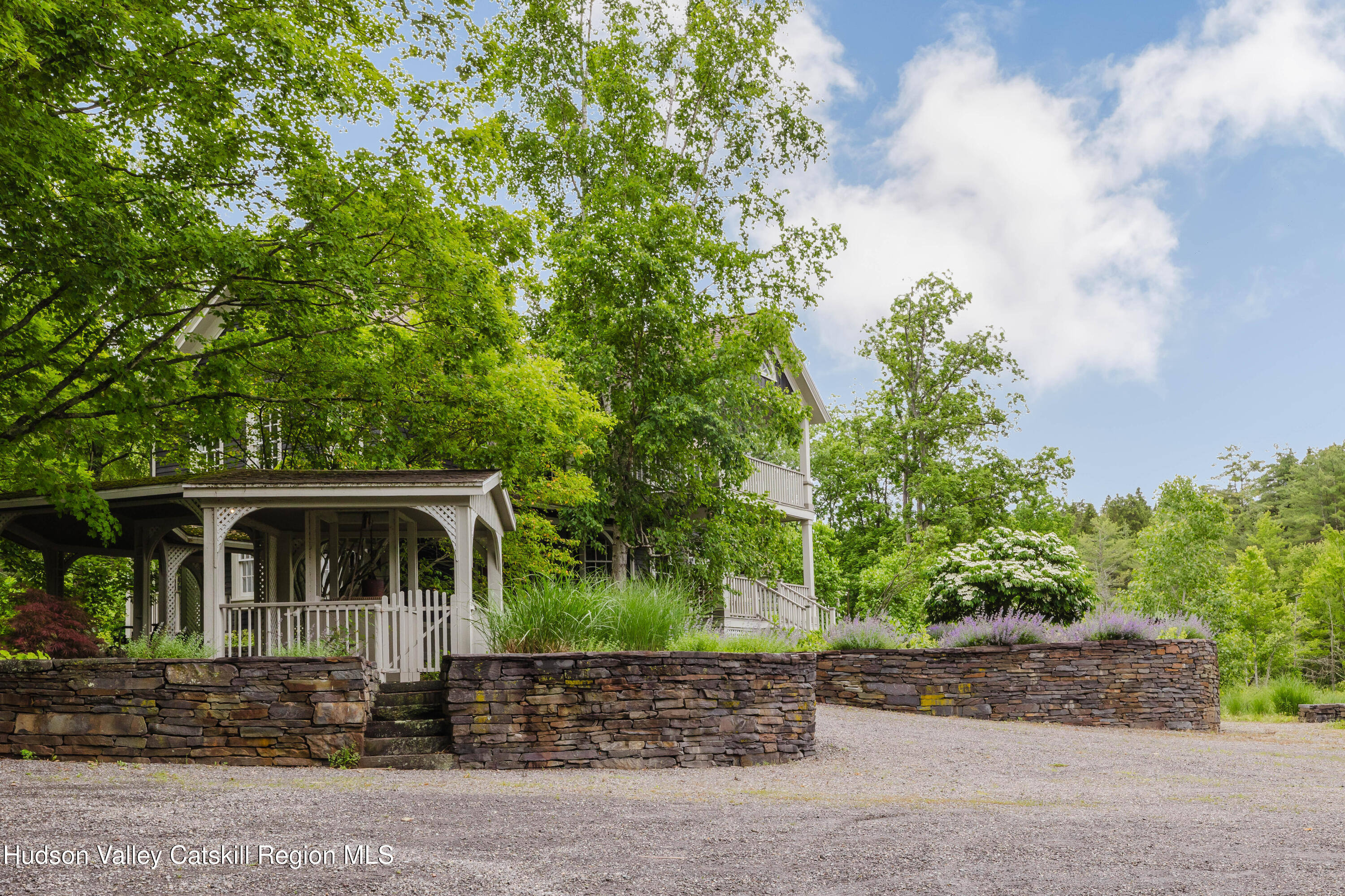 88 Mac Brown Road Hillsdale, NY 12529 - Photo 62 of 69 a front view of a house with a garden