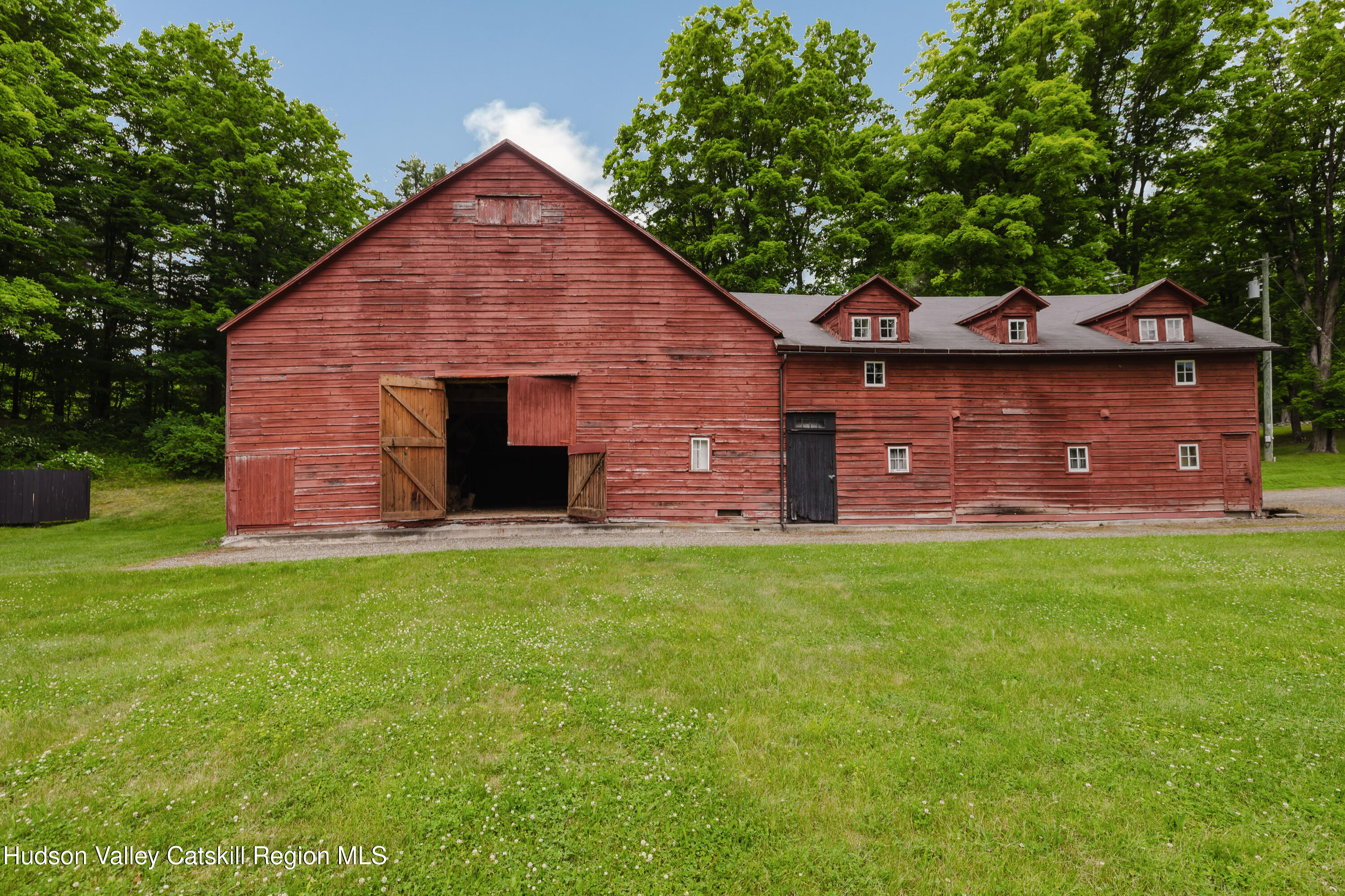 88 Mac Brown Road Hillsdale, NY 12529 - Photo 7 of 69 a front view of a house with a garden
