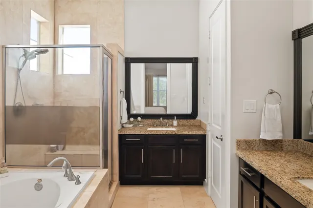 a bedroom with a bed and a night stand