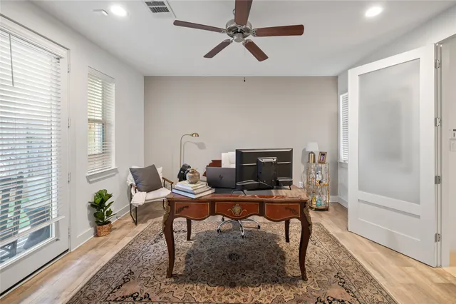a workspace with furniture and a window