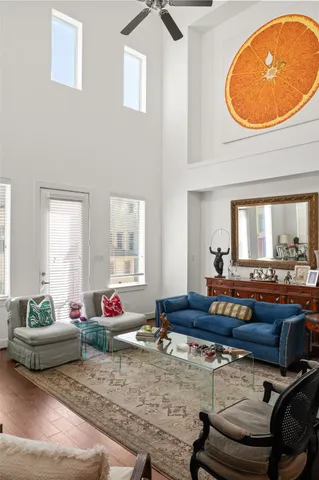 a living room with furniture and a potted plant