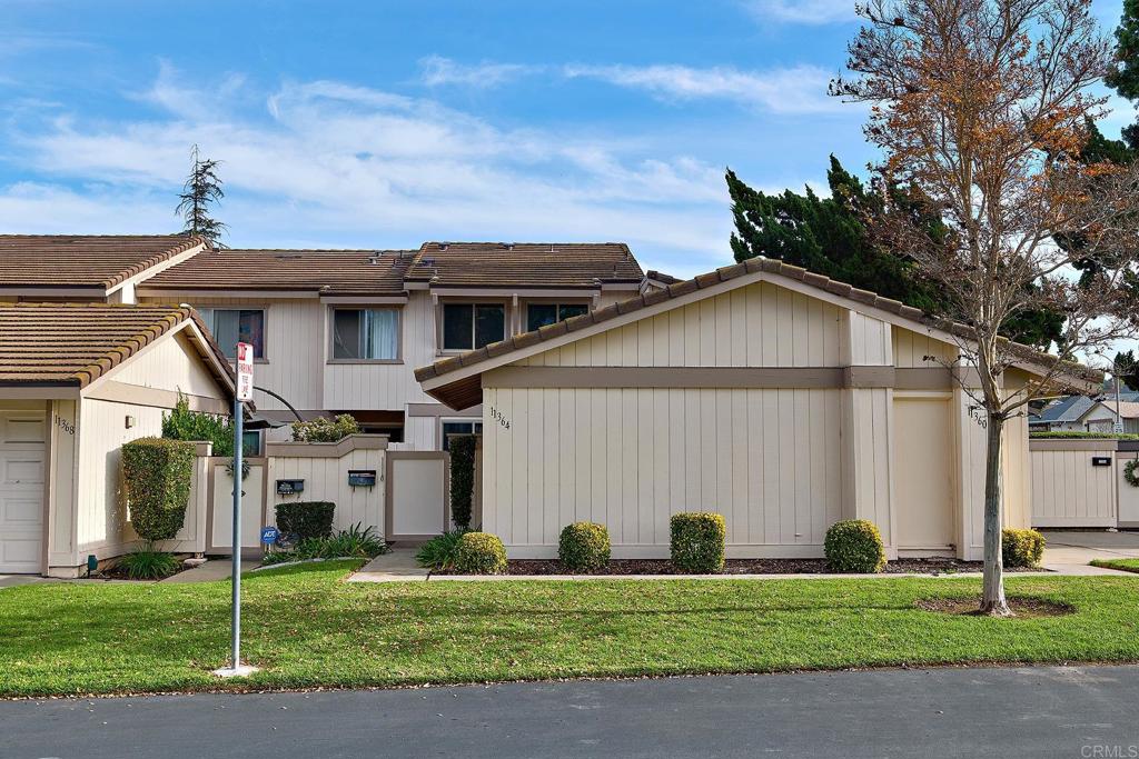 11364 Poblado Road San Diego, CA 92127 - Photo 2 of 39 a front view of a house with a yard