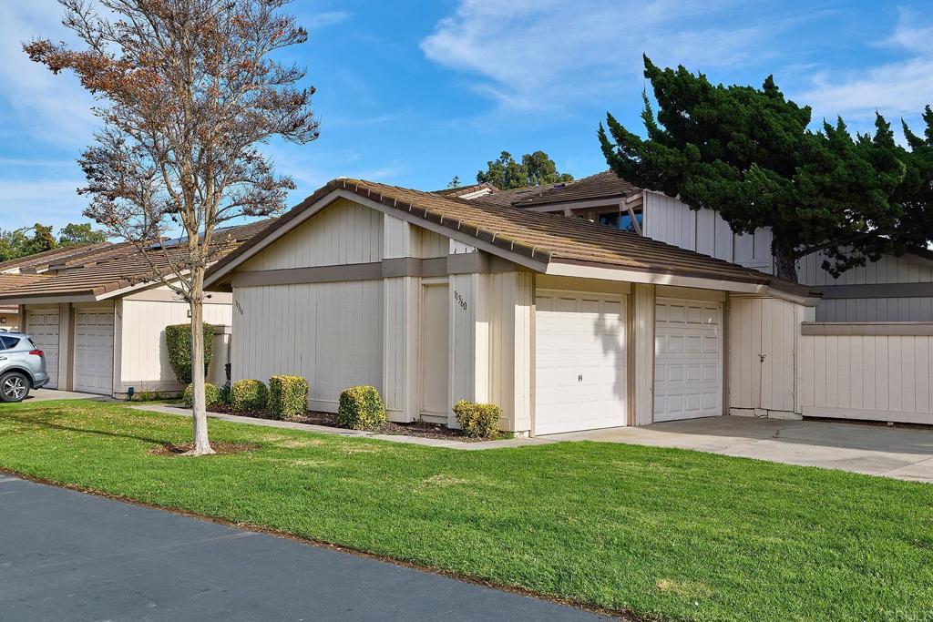 11364 Poblado Road San Diego, CA 92127 - Photo 27 of 39 a front view of a house with a yard