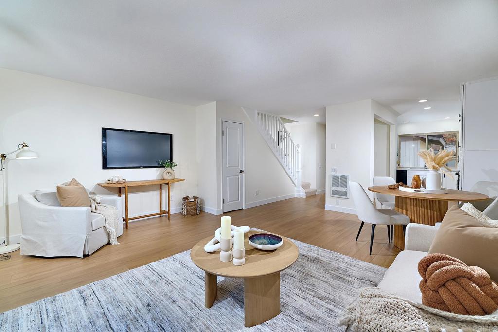 11364 Poblado Road San Diego, CA 92127 - Photo 10 of 39 a living room with furniture and a flat screen tv
