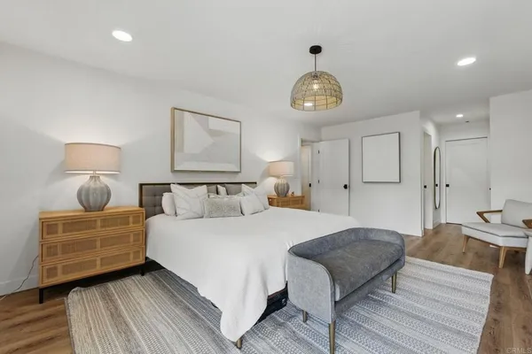a bedroom with bed and a window