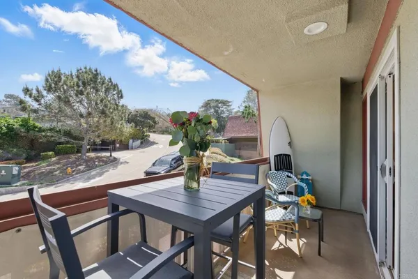 a outdoor dining space with furniture and outdoor view