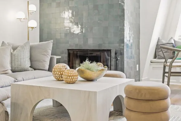 a living room with furniture and a fireplace
