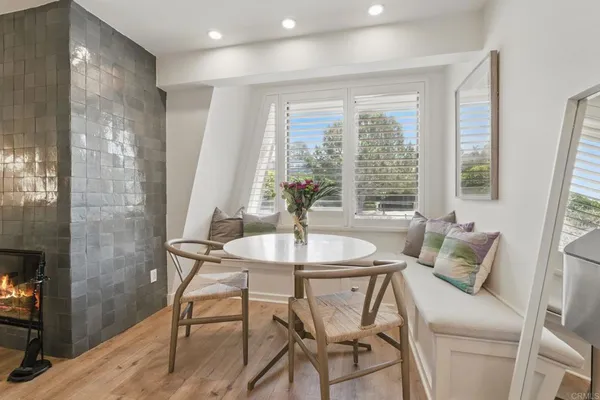a dining room with furniture and window
