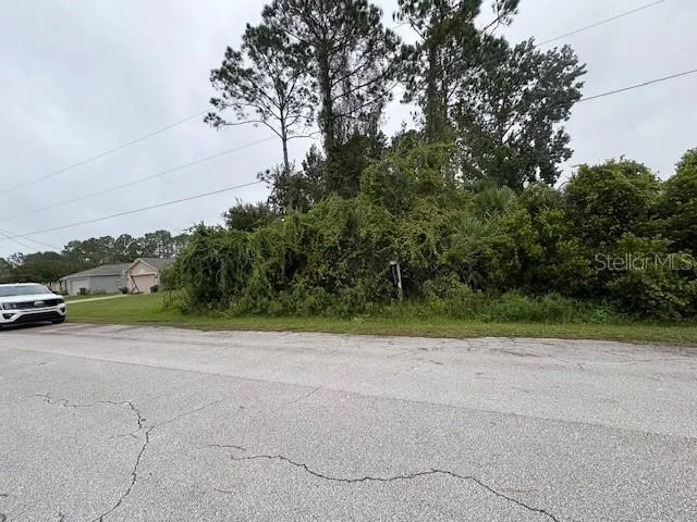 a view of a road with a building in the background