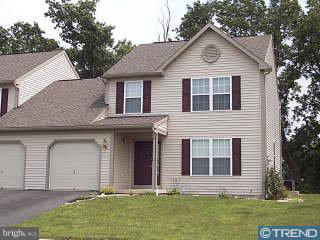 74 Michigan Drive Sinking Spring, PA 19608 - Photo 1 of 1 a front view of a house with a garden and yard