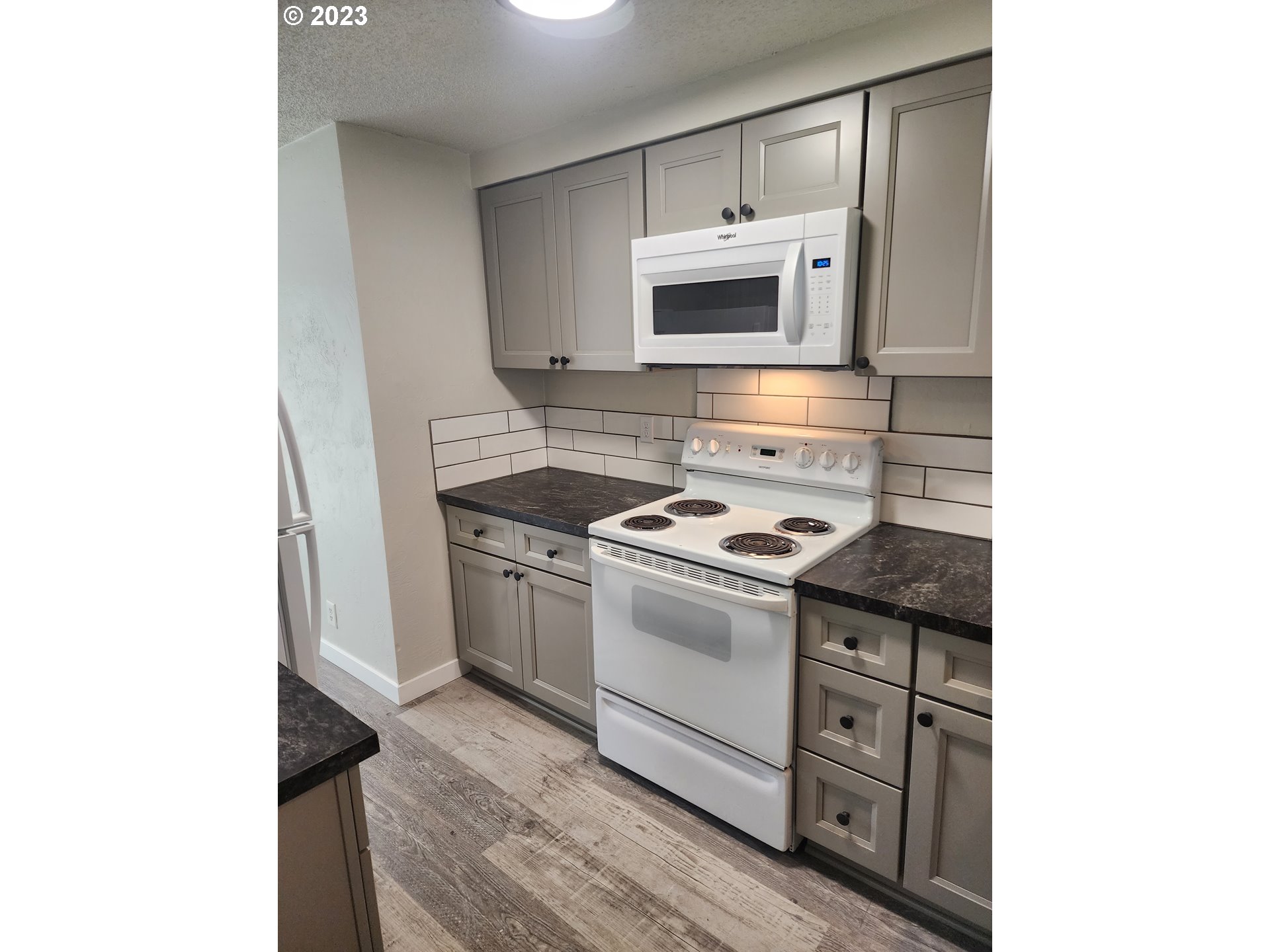 2263 2nd Street Springfield, OR 97477 - Photo 8 of 23 a kitchen with stainless steel appliances granite countertop a sink and a stove