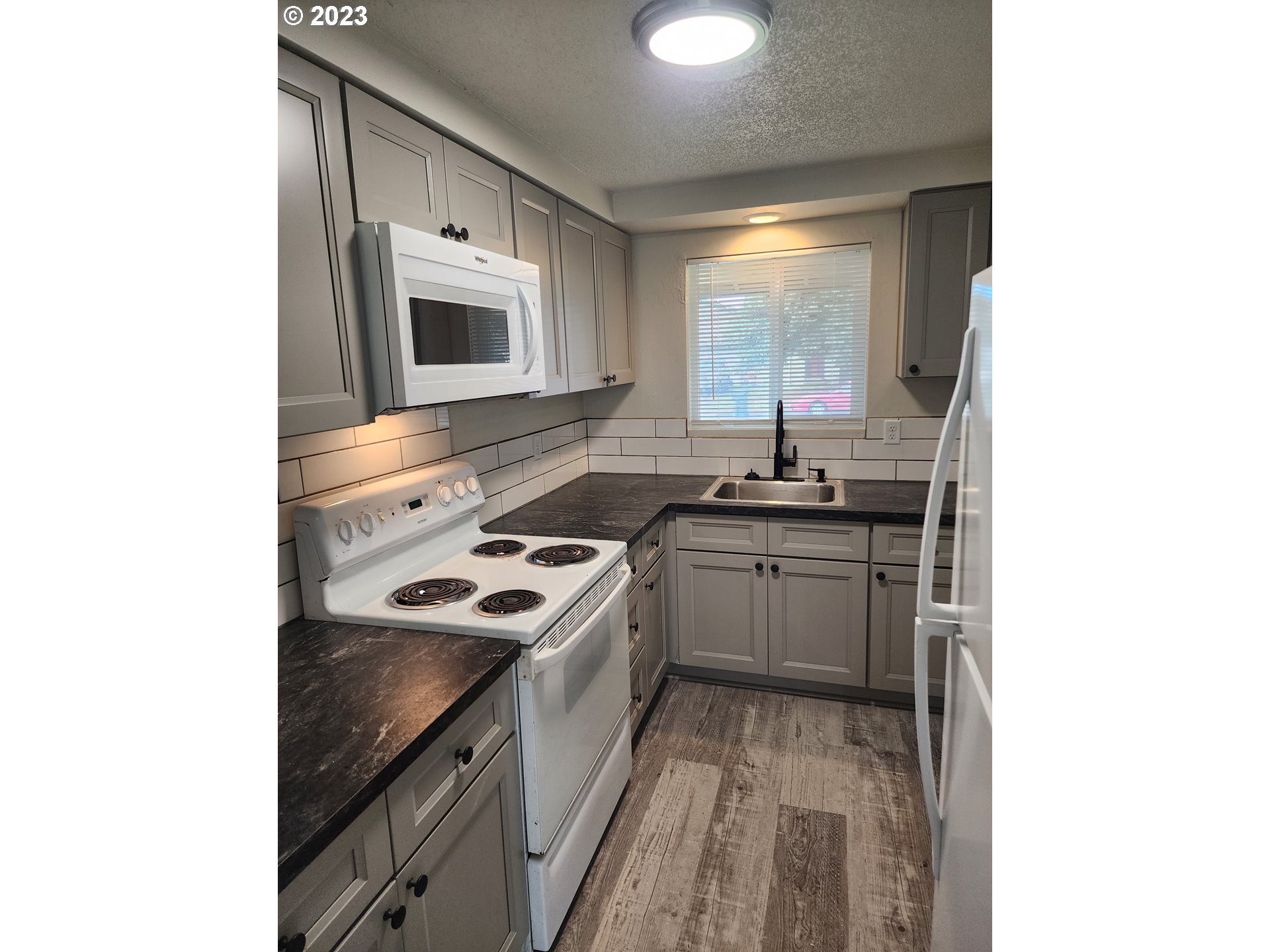 2263 2nd Street Springfield, OR 97477 - Photo 9 of 23 a kitchen that has a sink and a stove