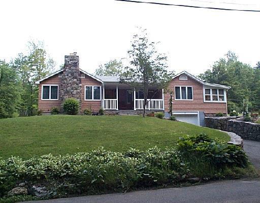 8 Middle River Road Danbury, CT 06811 - Photo 1 of 1 a view of a house with a yard and potted plants