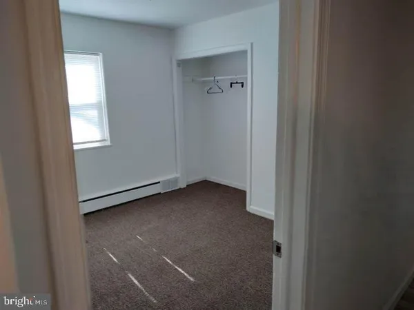 a bathroom with a sink toilet and mirror