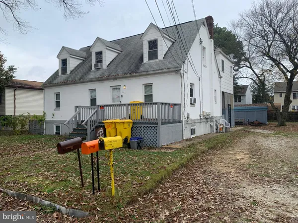 a view of a yard with car parked