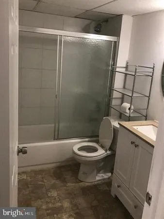 an empty room with a wooden door