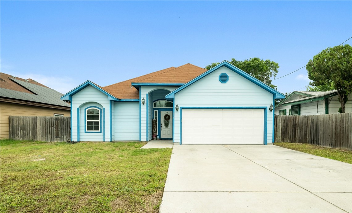 830 Tulia Street Corpus Christi, TX 78418 - Photo 1 of 1 a front view of a house with yard and garage