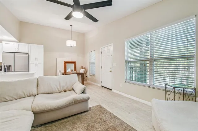 a living room with furniture and a large window
