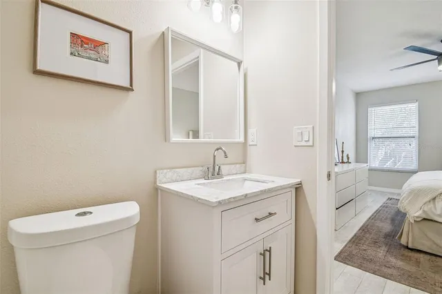 a view of a bathroom with a sink a toilet and a tub