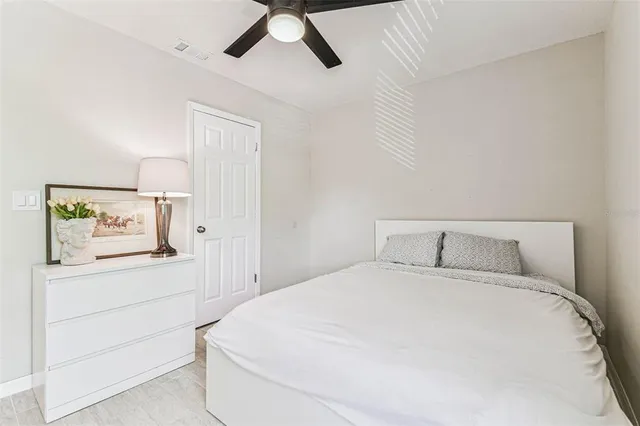 a large white bed in a white room