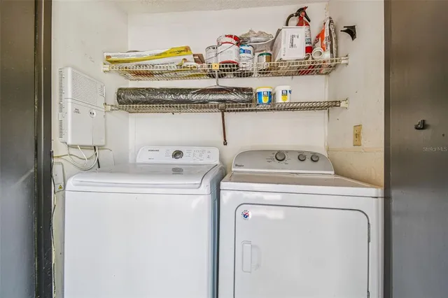 a utility room with dryer and washer