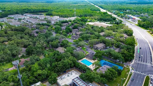 an aerial view of residential house with outdoor space and swimming pool
