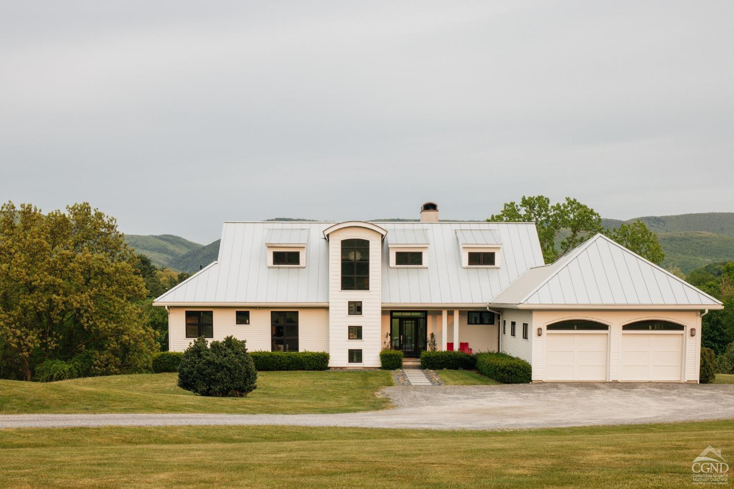 a front view of a house with a ocean view
