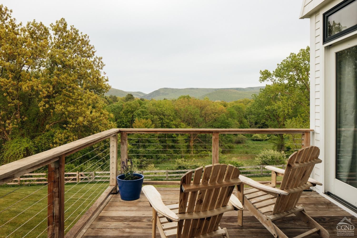 128 Robin Lane Copake, NY 12516 - Photo 16 of 33 a view of a balcony with mountain view and wooden floor