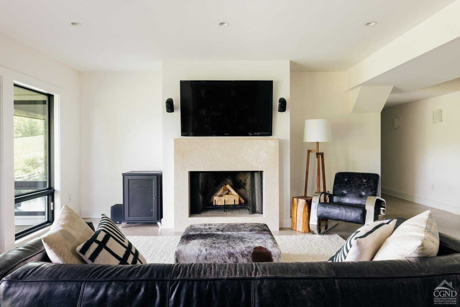 128 Robin Lane Copake, NY 12516 - Photo 20 of 33 a living room with furniture and a fireplace