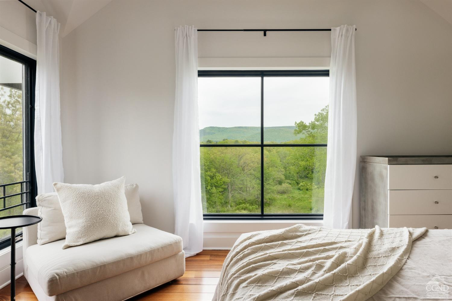 128 Robin Lane Copake, NY 12516 - Photo 22 of 33 a bedroom with a large window and a bed