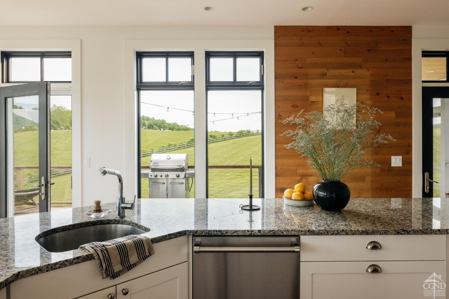 128 Robin Lane Copake, NY 12516 - Photo 8 of 33 a kitchen with granite countertop a sink and a large window