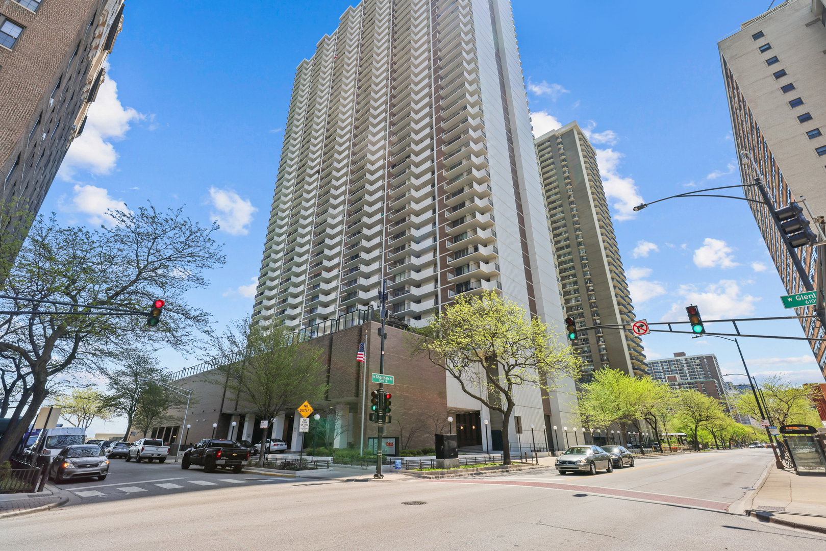 6033 North Sheridan Road, Unit 24B Chicago, IL 60660 - Photo 1 of 36 a view of a tall building next to a road