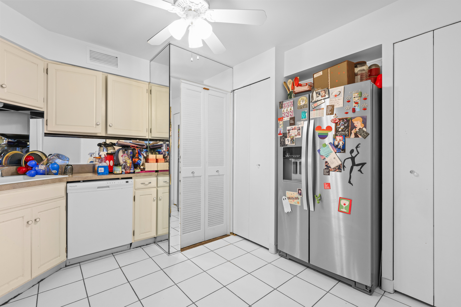 6033 North Sheridan Road, Unit 24B Chicago, IL 60660 - Photo 19 of 36 a view of kitchen with refrigerator and window