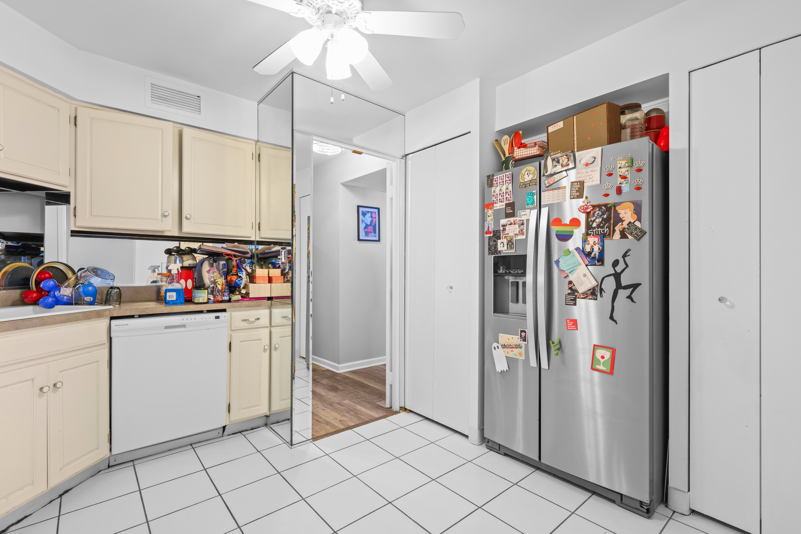 6033 North Sheridan Road, Unit 24B Chicago, IL 60660 - Photo 20 of 36 a kitchen with stainless steel appliances granite countertop a refrigerator and a sink