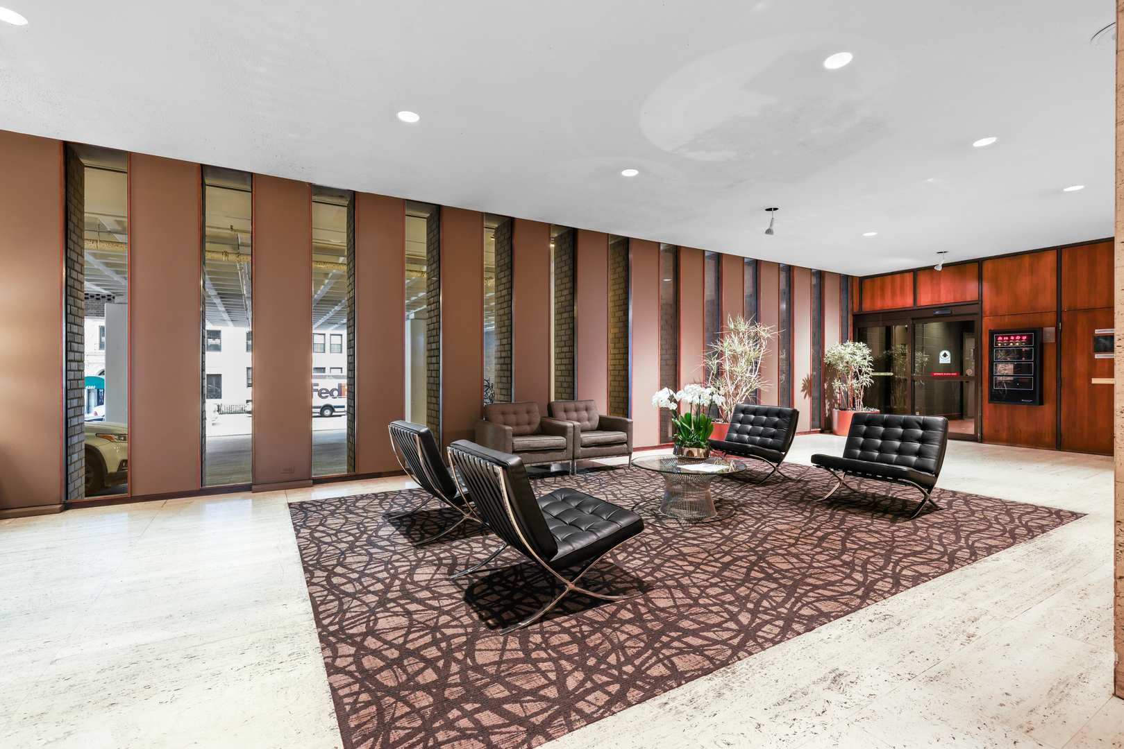6033 North Sheridan Road, Unit 24B Chicago, IL 60660 - Photo 30 of 36 a living room with furniture and floor to ceiling windows