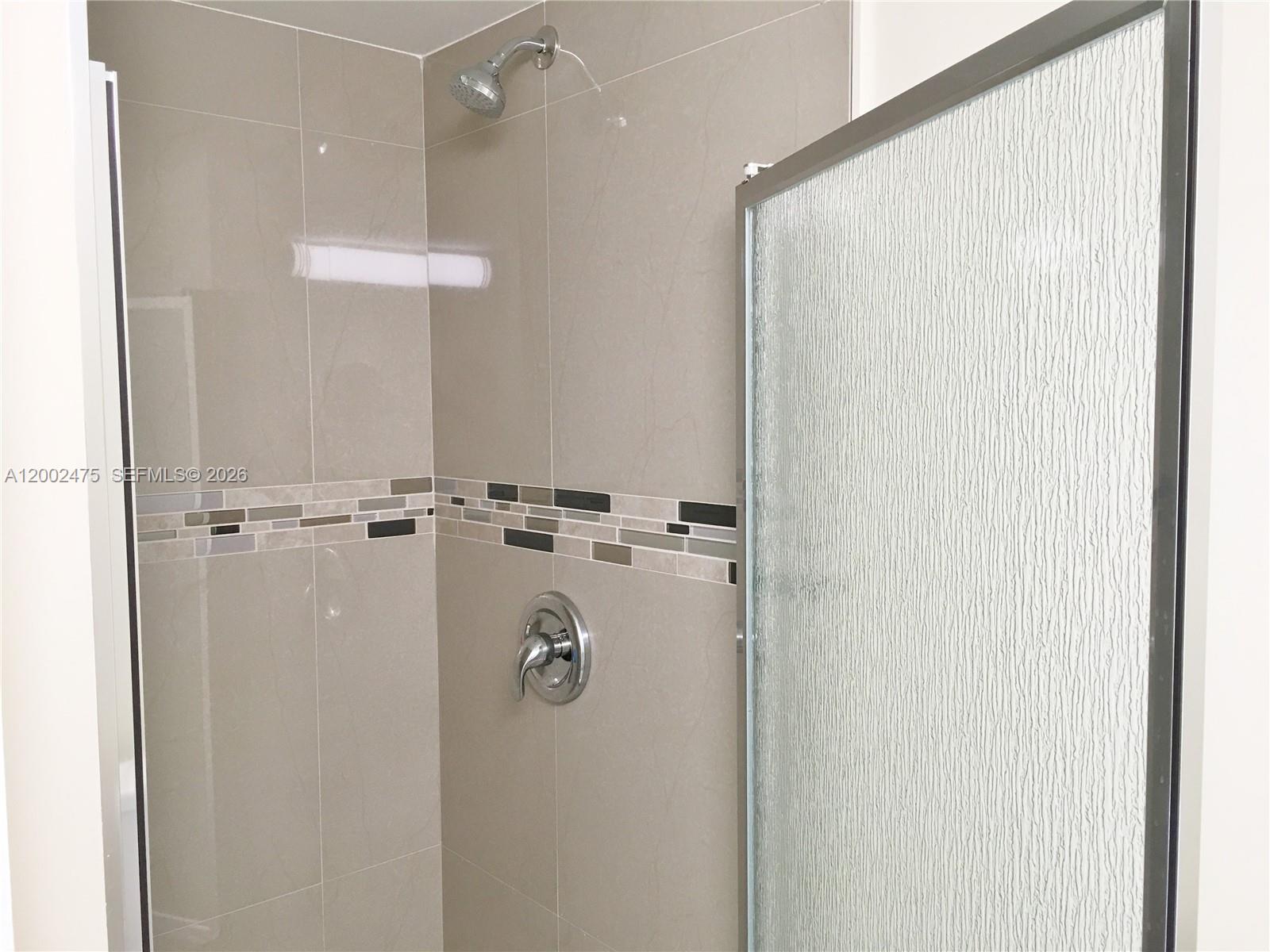 4709 Northwest 7th Street, Unit 1079 Miami, FL 33126 - Photo 13 of 28 a view of bathroom with shower