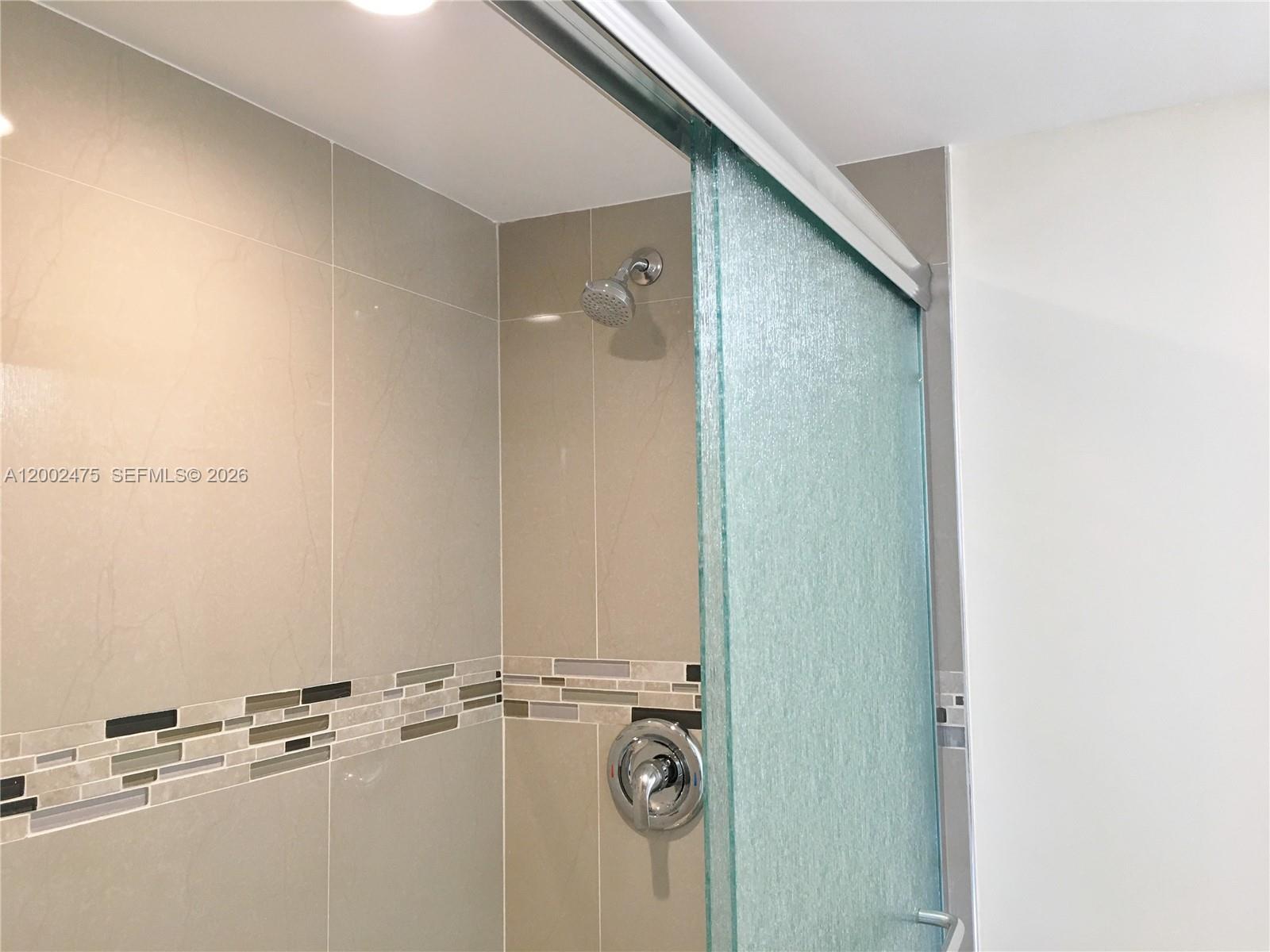 4709 Northwest 7th Street, Unit 1079 Miami, FL 33126 - Photo 17 of 28 a bathroom with a sink and mirror