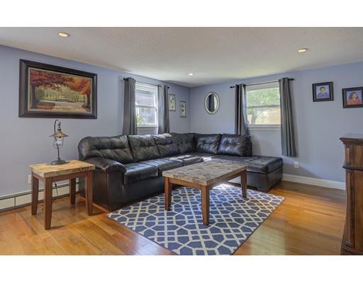 5 Olive Road Billerica, MA 01821 - Photo 16 of 27 a living room with furniture a rug and a window