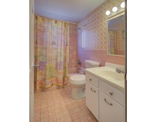 5 Olive Road Billerica, MA 01821 - Photo 18 of 27 a bathroom with a granite countertop toilet a sink and a mirror