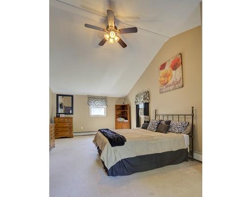 5 Olive Road Billerica, MA 01821 - Photo 19 of 27 a bedroom with a bed and a chandelier